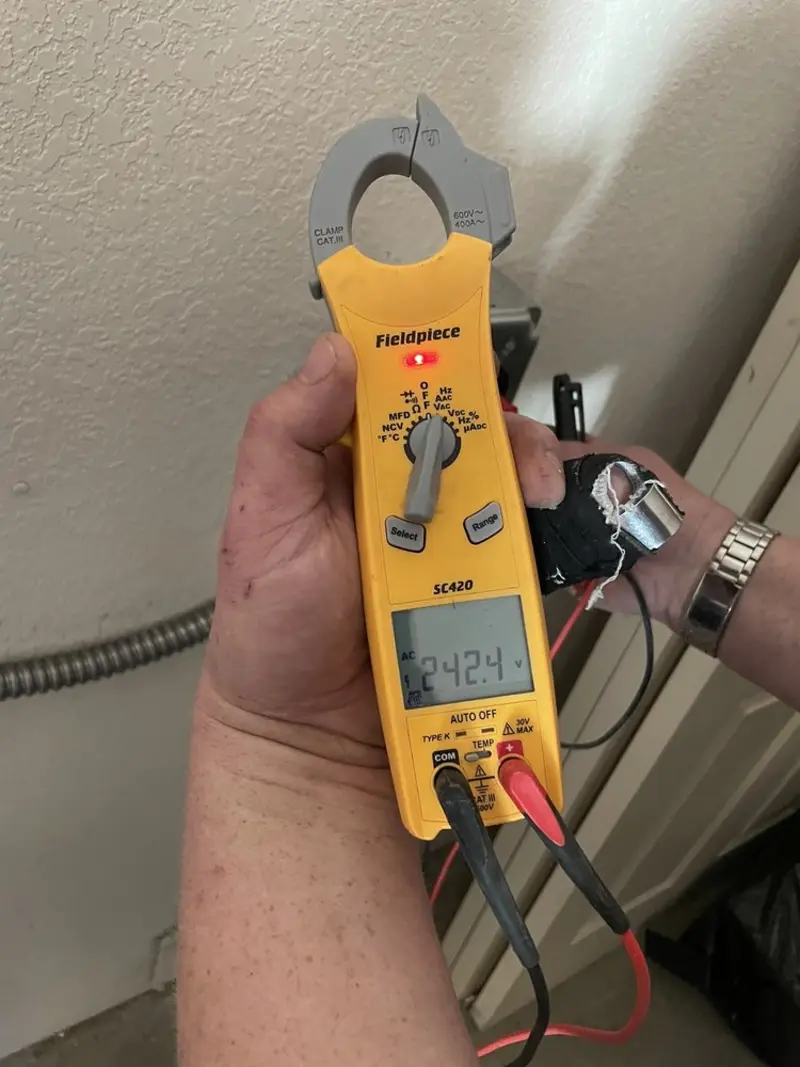 Voltage testing with clamp meter during Outlet Installation in Harrietstown